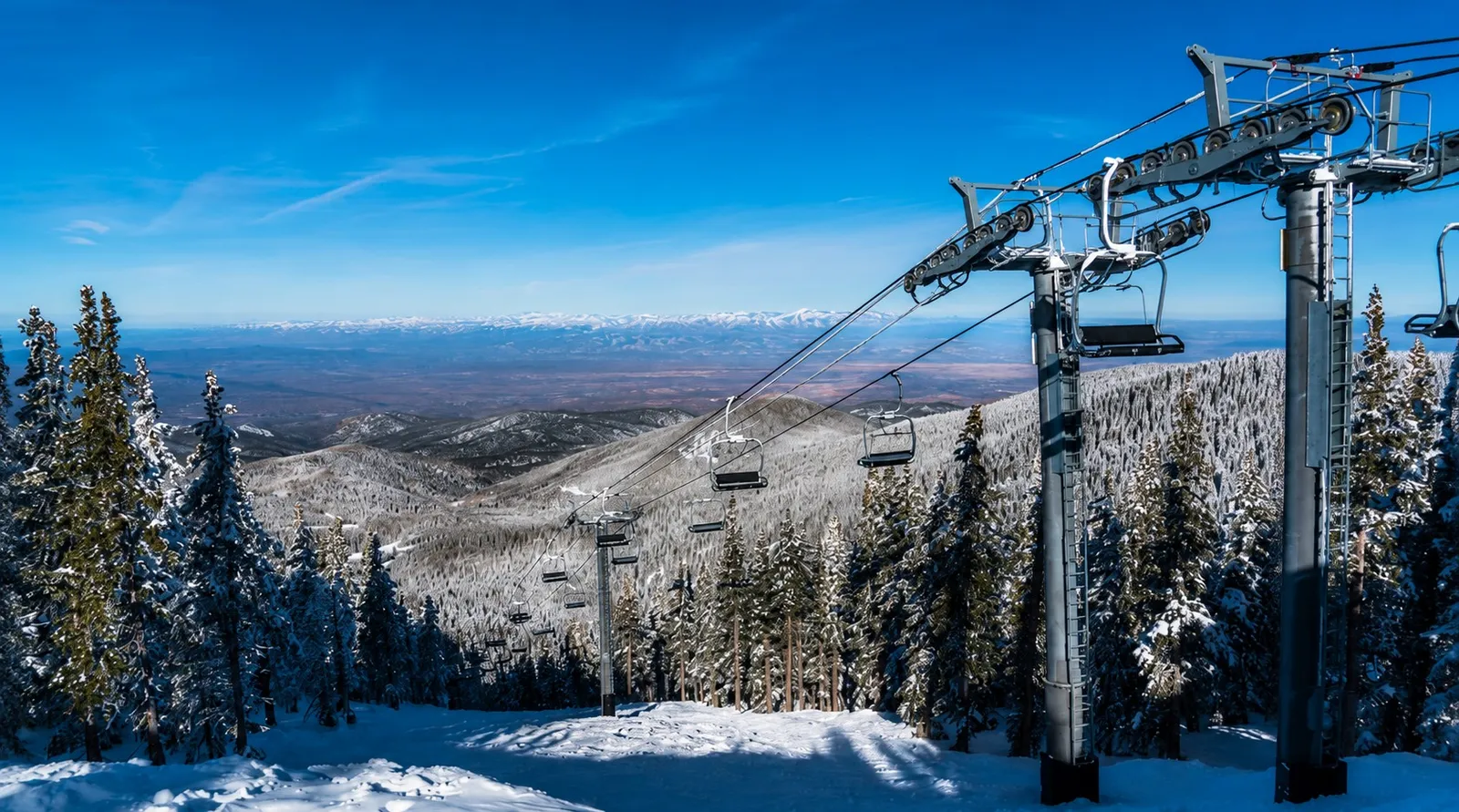 The surrounding mountains rising above Santa Fe